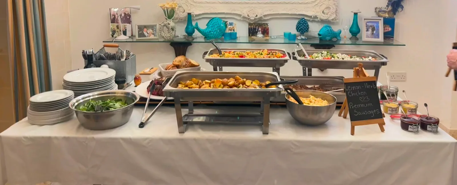 Sharing-style buffet table with seasonal salads, breads and homemade sauces