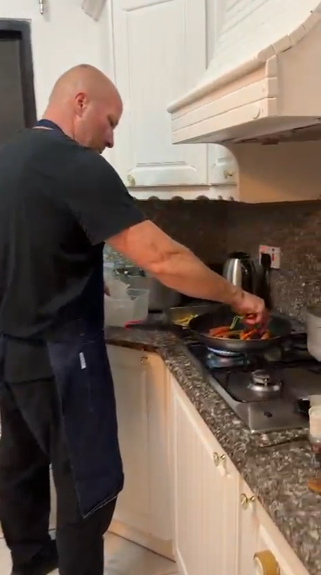 Chef Laszlo cooking in the family's kitchen in Swieqi